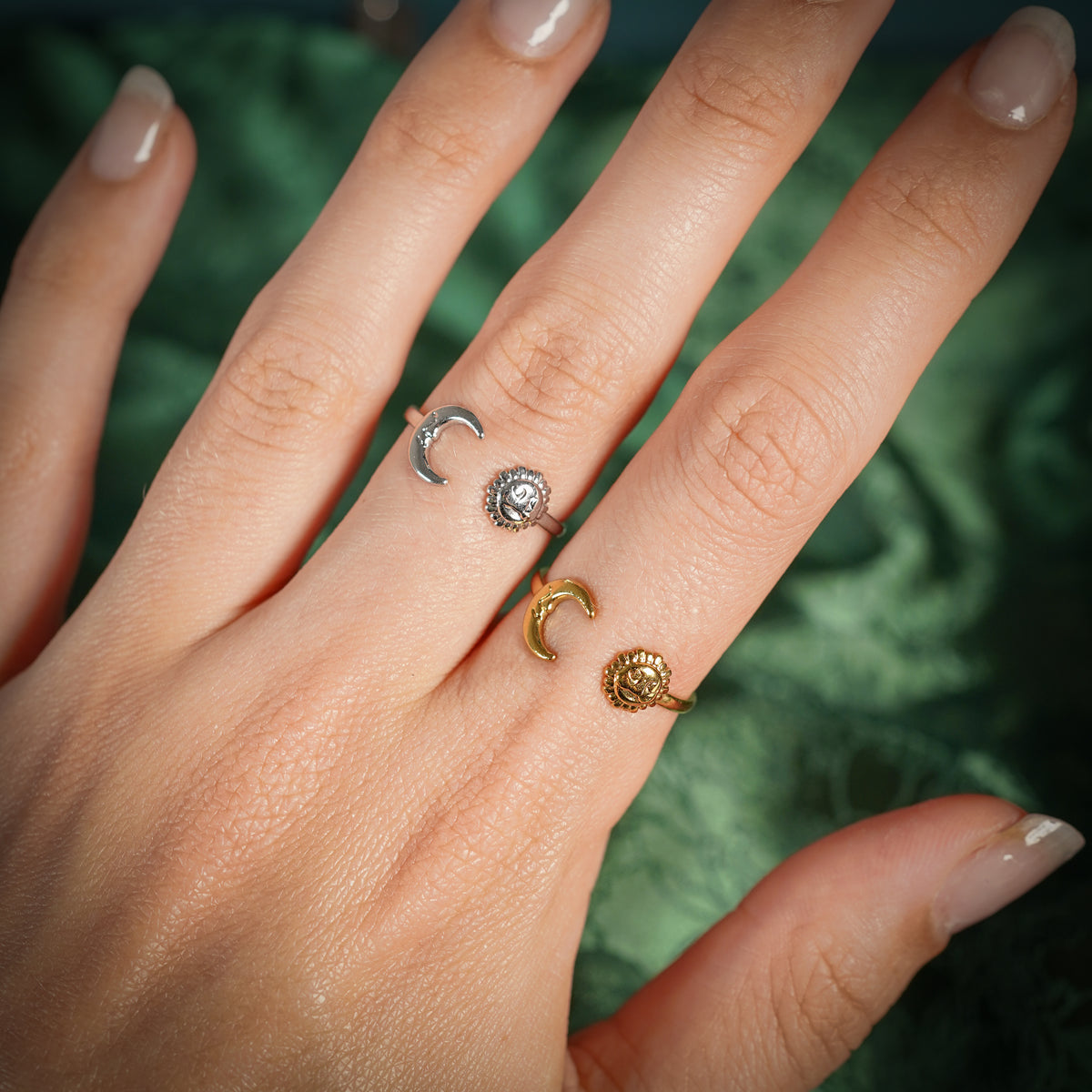Adjustable ring with sun and moon design on hand