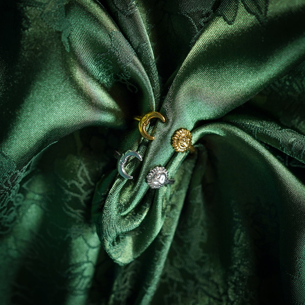 Adjustable ring with sun and moon design on silk