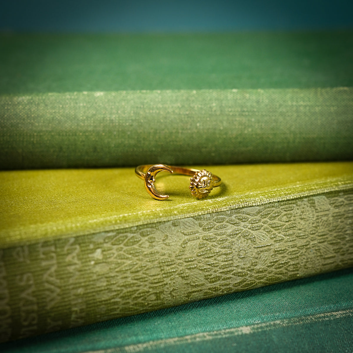 Gold Adjustable ring with sun and moon design close up
