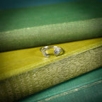 Silver adjustable ring with sun and moon design on book